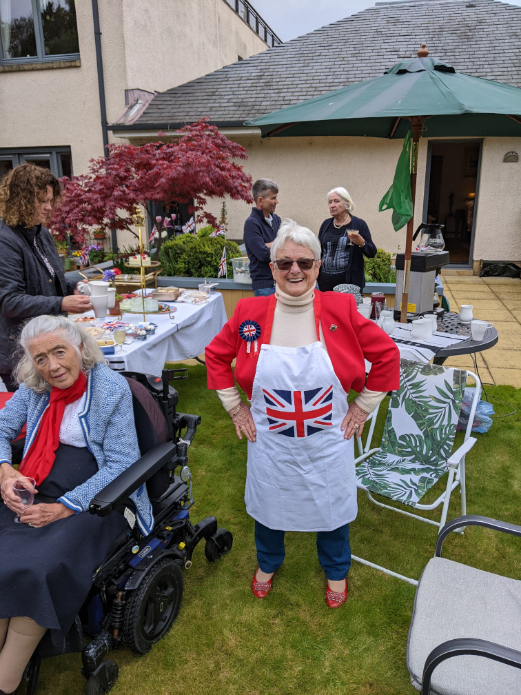 Marjory in a pinafore with Union flag.